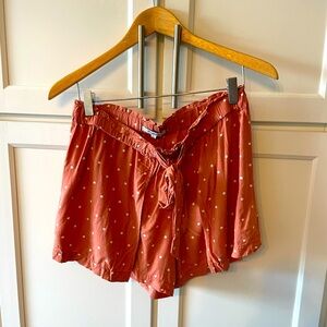 Madewell rust colored shorts with white polka dots